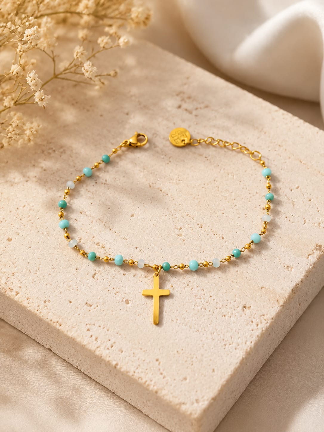 pulsera cruz cristal azul claro