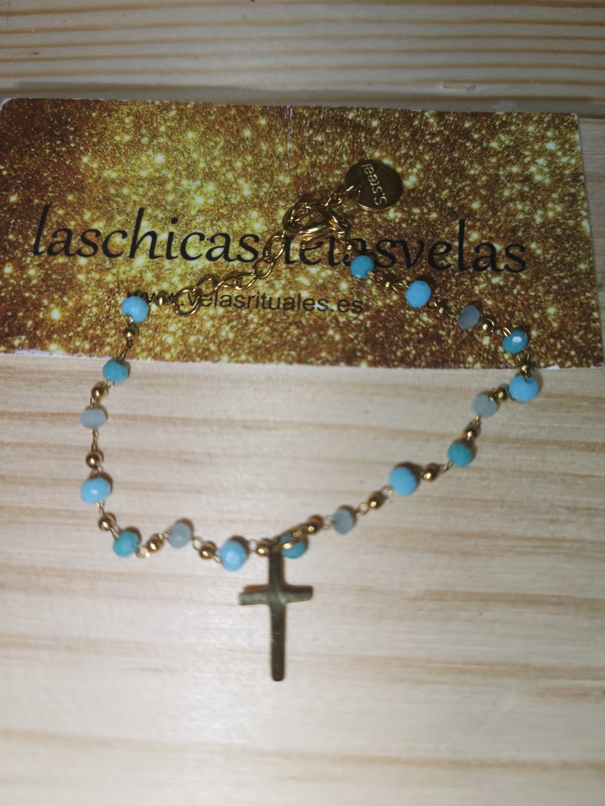 pulsera cruz cristal azul claro